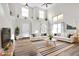 Bright, airy living room with hardwood floors, vaulted ceilings and decor shelves above entry and windows at 11124 Deer Valley Dr, Indianapolis, IN 46229