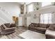 Spacious living room featuring soaring ceilings, neutral paint, and cozy seating at 11124 Deer Valley Dr, Indianapolis, IN 46229