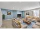 Staged living room featuring recessed lighting, plush seating, and neutral walls at 11124 Deer Valley Dr, Indianapolis, IN 46229