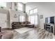 Spacious living room with soaring ceilings, cozy seating, and a decorative entertainment center at 11124 Deer Valley Dr, Indianapolis, IN 46229