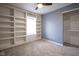Bedroom with carpet, built-in shelving, and a closet for ample storage at 1163 Randall Way, Brownsburg, IN 46112