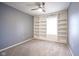 Carpeted bedroom featuring built-in shelving and natural light from a window at 1163 Randall Way, Brownsburg, IN 46112