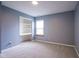 Bedroom with neutral carpet, built-in desk, and good natural light at 1163 Randall Way, Brownsburg, IN 46112