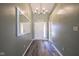 Entryway features modern chandelier, durable flooring and access to coat closet at 1163 Randall Way, Brownsburg, IN 46112