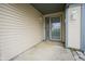 Covered front porch with vinyl siding and storm door offers a welcoming entrance at 1163 Randall Way, Brownsburg, IN 46112