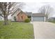 Charming single-story home features a brick facade, neutral siding and attached garage at 1163 Randall Way, Brownsburg, IN 46112