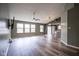 Open-concept living room features many windows and durable flooring at 1163 Randall Way, Brownsburg, IN 46112