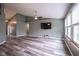 Open-concept living room features many windows and durable flooring at 1163 Randall Way, Brownsburg, IN 46112