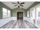Inviting sunroom with lots of natural light that opens to the kitchen at 1163 Randall Way, Brownsburg, IN 46112