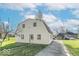 Exterior of a charming barn-style home with a classic gable roof and well-maintained lawn at 12125 Broadway St, Indianapolis, IN 46236