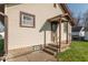 Exterior of home showcasing tan siding, covered front porch and steps at 12125 Broadway St, Indianapolis, IN 46236