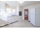 Kitchen features white cabinetry, linoleum flooring, and stainless appliances at 12125 Broadway St, Indianapolis, IN 46236
