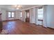 Spacious living room with hardwood floors, large windows, and natural light at 12125 Broadway St, Indianapolis, IN 46236