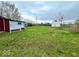 Large backyard with lots of space and a few outbuildings in need of repair at 1237 N Sheffield Ave, Indianapolis, IN 46222