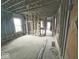 Wide view of the home's interior, showing exposed studs and structural elements at 1237 N Sheffield Ave, Indianapolis, IN 46222