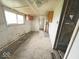 Another interior view of the home featuring bare walls, ceilings, and minimal cabinetry at 1237 N Sheffield Ave, Indianapolis, IN 46222
