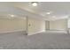 Unfinished basement featuring neutral paint and gray carpet at 12535 Glendurgan Dr, Carmel, IN 46032