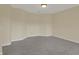 Unfinished basement featuring neutral paint and gray carpet at 12535 Glendurgan Dr, Carmel, IN 46032