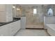 Bathroom features a large glass shower with decorative tile, black trim, and updated vanity at 12535 Glendurgan Dr, Carmel, IN 46032
