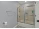Bathroom featuring a shower with sliding doors, chrome fixtures, and gray wall color at 12535 Glendurgan Dr, Carmel, IN 46032
