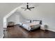 Bedroom featuring two beds, hardwood floors, and a ceiling fan at 12535 Glendurgan Dr, Carmel, IN 46032