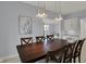 Dining room with an oversized wood table and views into the living space at 12535 Glendurgan Dr, Carmel, IN 46032