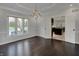 Dining room with lake views and access to the kitchen through double doors at 12535 Glendurgan Dr, Carmel, IN 46032