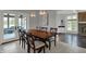 Dining area with access to an outdoor patio and views to a cozy living area with fireplace at 12535 Glendurgan Dr, Carmel, IN 46032