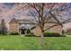 Charming exterior of a brick home with a manicured lawn and lovely landscaping details at 12535 Glendurgan Dr, Carmel, IN 46032