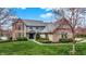 Beautiful brick two-story home boasts mature trees, well-kept lawn and manicured landscaping at 12535 Glendurgan Dr, Carmel, IN 46032