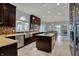 Gourmet kitchen featuring custom cabinetry, stainless steel appliances, and granite countertops at 12535 Glendurgan Dr, Carmel, IN 46032