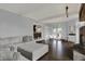 Open-concept living room with a fireplace and lots of natural light at 12535 Glendurgan Dr, Carmel, IN 46032