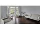 Hardwood flooring and neutral-toned furniture in room with natural light at 12535 Glendurgan Dr, Carmel, IN 46032