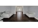 Bright living space with dark hardwood floors and neutral-toned furniture at 12535 Glendurgan Dr, Carmel, IN 46032