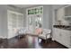 Bright sun room with stained-glass windows and outside access at 12535 Glendurgan Dr, Carmel, IN 46032