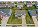 Aerial view of suburban two-story home with neatly manicured lawn, attached two-car garage, and surrounding neighborhood at 1279 Windswept Dr, Greenwood, IN 46143