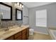 Updated bathroom features a double sink vanity, decorative backsplash and a soaking tub at 1279 Windswept Dr, Greenwood, IN 46143
