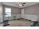Bedroom with natural light, exercise equipment, and neutral colors at 1279 Windswept Dr, Greenwood, IN 46143