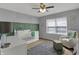 Bedroom with a white crib, a cozy chair, and a gray rug at 1279 Windswept Dr, Greenwood, IN 46143