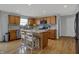 Charming kitchen with a center island, stainless steel appliances, and wooden cabinets at 1279 Windswept Dr, Greenwood, IN 46143