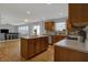 Well-lit kitchen with a center island open to the living room for easy entertaining at 1279 Windswept Dr, Greenwood, IN 46143