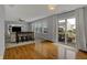 Bright living room with hardwood floors, built-ins, and sliding door to the backyard at 1279 Windswept Dr, Greenwood, IN 46143