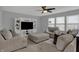 Spacious living room with a large entertainment center and comfortable seating with neutral carpet at 1279 Windswept Dr, Greenwood, IN 46143