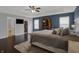 Serene main bedroom with tray ceilings, a king bed and en-suite bathroom at 1279 Windswept Dr, Greenwood, IN 46143