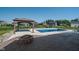 Backyard features a pool, gazebo, stone fire pit and stamped concrete patio at 12988 Fernie Cir, Fishers, IN 46037