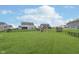 Expansive backyard with a black fence, play set, and trampoline at 12988 Fernie Cir, Fishers, IN 46037