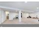Expansive basement area with carpeted floors, support beams, and ample space for various activities at 12988 Fernie Cir, Fishers, IN 46037