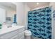 Well-lit bathroom featuring a shark-themed shower curtain, vanity, and toilet at 12988 Fernie Cir, Fishers, IN 46037