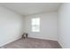 Neutral bedroom with plush carpet and natural light is perfect for relaxation or study at 12988 Fernie Cir, Fishers, IN 46037