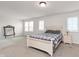 Spacious bedroom with a bed, large windows, and neutral decor at 12988 Fernie Cir, Fishers, IN 46037